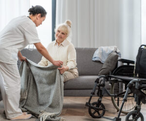 doctor-taking-care-senior-woman-home