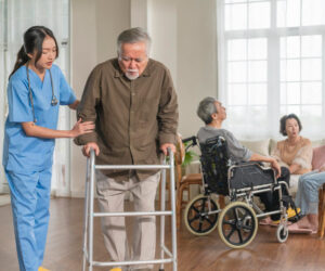 young-asian-female-nurse-care-giver-helping-asian-senior-old-man-with-mobility-walker-living-area-nursing-home-senior-daycare-centernurse-take-care-elderly-patient-with-cheerful-concentrate